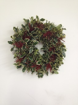 Original holly wreath made with seasonal greens